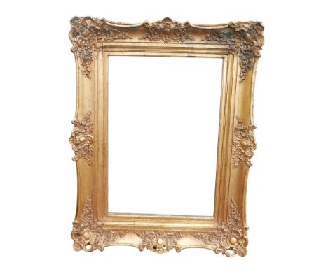 A modern ornate gilt framed rectangular mirror 