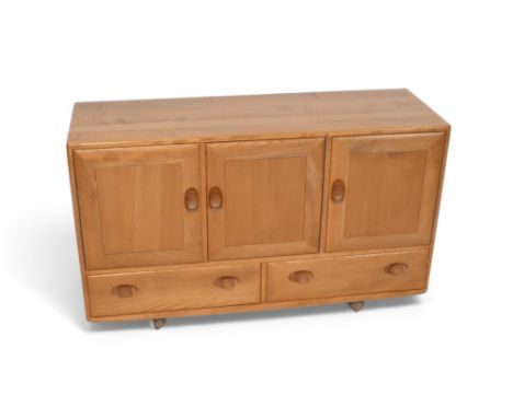An Ercol blonde elm sideboard with three cupboard doors above two drawers, model 468, 129.5 by 44 by 76cm tall. 