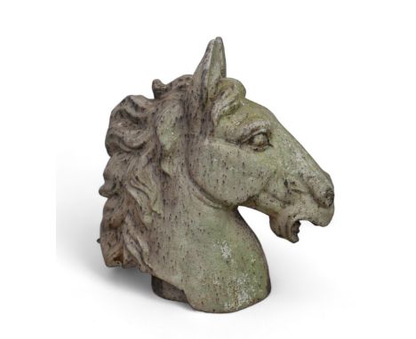 A cast metal model of a horse’s head, ears up. 