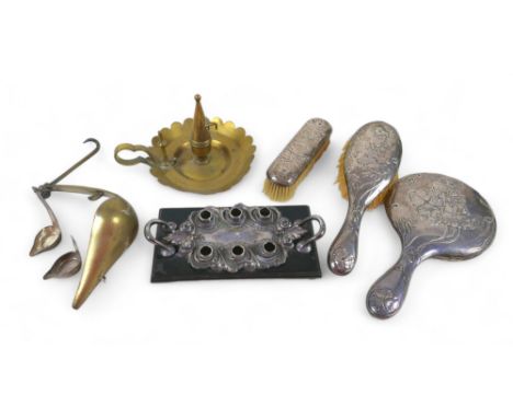 A mixed group of silver and plated items, including three piece, silver backed brush ad mirror set, a brass chamber stick, a 