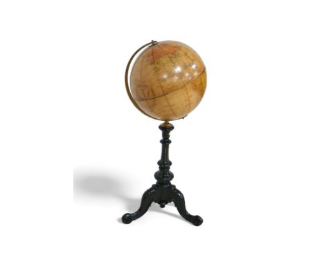A Phillips 12 inch terrestrial library globe on an ebonies tripod stand, 34 by 90 cm tall. 