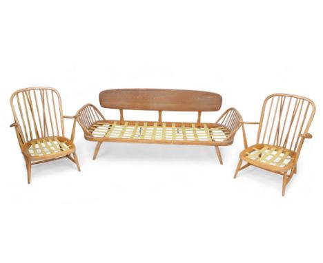 An Ercol day bed and two matching armchairs, daybed measures 208 by 77 by 77cm high, and chairs 71 by 70 by 89cm high. (3) 