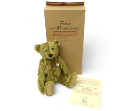 Steiff teddy bear with hot water bottle 1907, brass coloured mohair, posable five jointed bear standing 50cm tall, limited ed