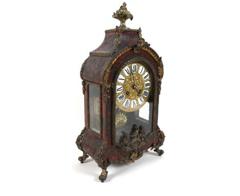 A 19th century French Bouille tortoiseshell and ormolu mantle clock with scroll acanthus and bird decoration, sunburst pendul