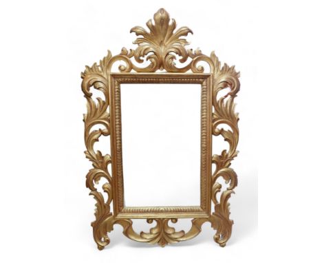 A modern decorative gold coloured mirror. 
