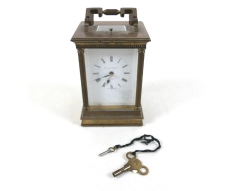 A good quality brass carriage clock with repeat by Matthew Norman London, striking on a gong 10cm by 9cm by 19cm. Movement nu