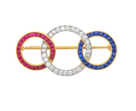 A Mid 20th Century Ruby, Diamond and Sapphire Broochcomprising of three intertwined graduated hoops, each inset with either c