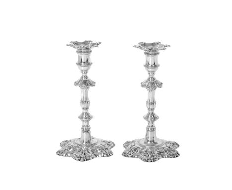 Two George III Silver Candlesticks,  by Robert Jones and John Scofield, London, 1776  each on stepped hexafoil base with shel