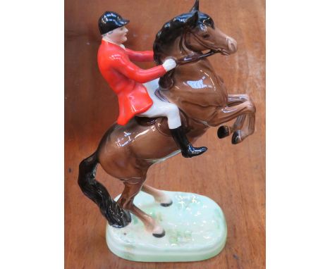 BESWICK GLAZED CERAMIC FIGURE OF A HUNTSMAN ON A REARING HORSE, No 868, APPROXIMATELY 26cm HIGH 