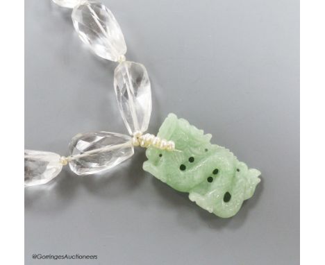   A shaped facet cut rock crystal necklace, with carved jade pendant, seed pearl bale and white metal clasp, necklace approx.