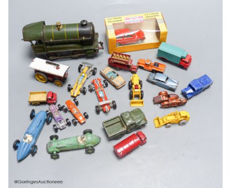   A mixed group of toy cars and an engine (railway)