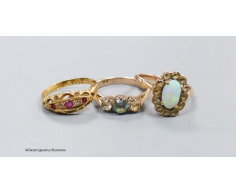   An 18ct gold ruby and diamond ring, size M, 2g. and two other 9ct gold dress rings