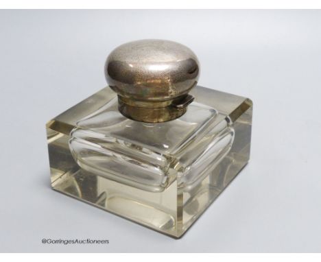   A George V large silver topped glass inkwell, makers mark C and co-, London 1912, 12.5 cm wide