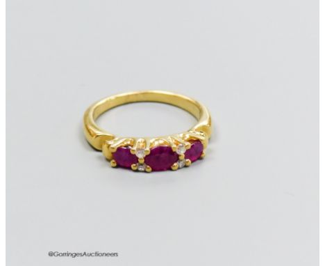   A 18ct gold ruby and diamond ring, size M, gross 5g.