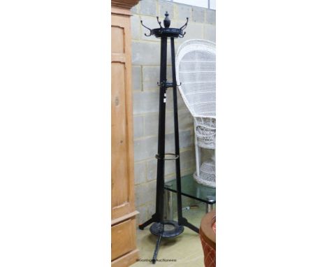   A late Victorian Godwin style black painted coat and stick stand, height 200cm