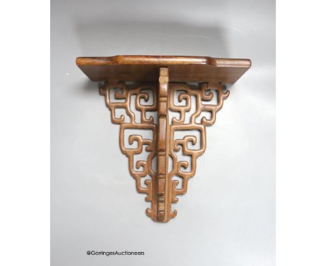  A Chinese hardwood wall bracket, late Qing, length 23cm