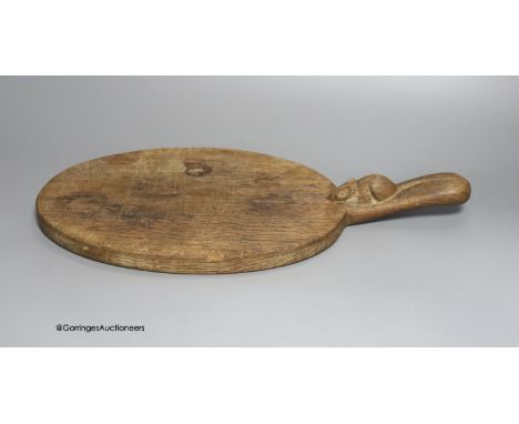   A Mouseman cheeseboard, length 38cm