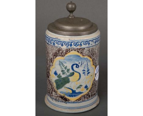 Walzenkrug. Wohl Bayreuth 1780. Mangan gesprenkelter Fond, bunt bemalt mit einem Pfau, H=16,3 bzw. 20,7 cm. (best.)