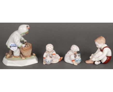 Vier Kinderfiguren. Porzellan, bunt bemalt. Am Boden gemarkt Budapest bzw. Zsolnay, H=7,5 cm bis 15 cm.