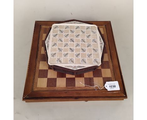 A wooden boxed chess set plus an octagonal box chess set