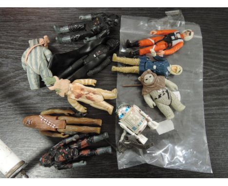 A selection of vintage star wars figures, including 1980s and a Star Wars bedspread 