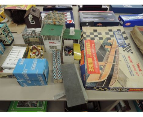 A selection of Tri-ang and similar Scalextric accessories including lap recorder 221E, boxed, start finish banner 212A boxed,