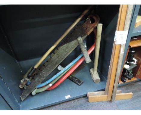 A selection of vintage tools including saws and squares 