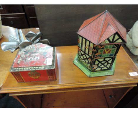 A vintage Victory lozenge tin modelled as garden house and a Bassett tin having day date