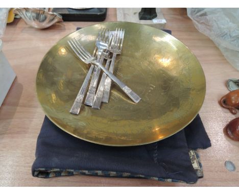 A selection of metalware, including brass plaque, steel flatware and tapestry