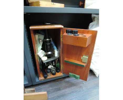 A vintage microscope in case
