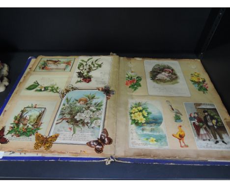 A vintage scrap album including Christmas greetings cards