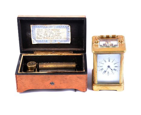 Maple cased Swiss musical box, 9.5cm drum playing six airs, 17cm wide; and a brass-cased carriage clock, 12.5cm high.Conditio