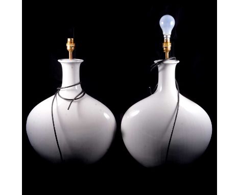 Two modern ceramic lamp bases, flattened flask form, plain white glaze, 52cm including fittings.
