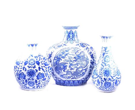 Three large modern Chinese style vases, blue and white transferred, one flattened flask with dragon and flaming pearl, 46cm, 