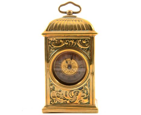 Brass carriage clock, scroll embossed case, circular dial, British United Clock Co. movement, 15cm.Condition report:There is 
