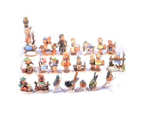 Fifteen Hummel figurines and a lamp base with girl on a flowering branch, 25cm including fittings; and five Goebel bird figur