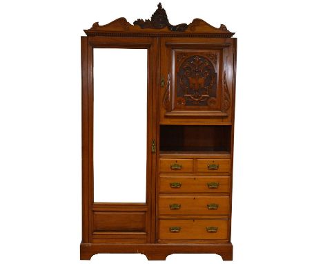 Victorian walnut compactum wardrobe, carved rococo cornice, the mirrored robe enclosing a hanging rail and drawer, flanked by