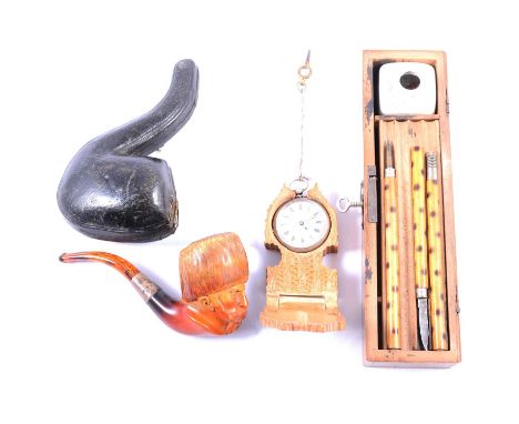 Meerschaum pipe, carved as a Cossack gent, white metal collar, in fitted case; another German pipe with taxidermy deer foot s