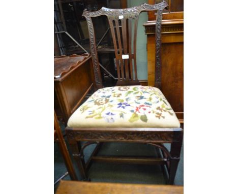 A fancy carved Georgian design single chair with tapestry seat pad