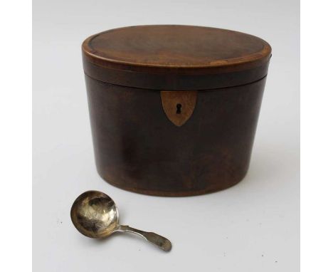 A George II mahogany oval single tea caddy, 12cm high, together with a silver caddy spoon