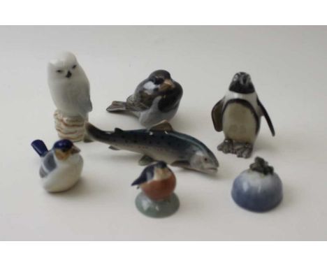 A collection of seven Royal Copenhagen ceramic figures, includes; frog, salmon, owl, penguin, etc.&nbsp;