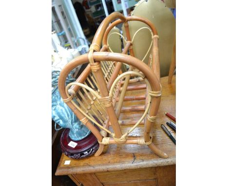 A bamboo magazine rack together with an Ercol stick back chair