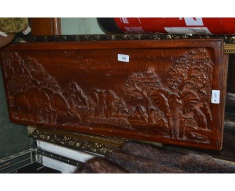 A gilt framed robing mirror together with a carved wooden panel depicting elephants