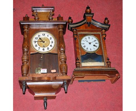 An early 20th century walnut and ebonised mantel clock, having an enamelled dial with Roman numerals; together with a beech c