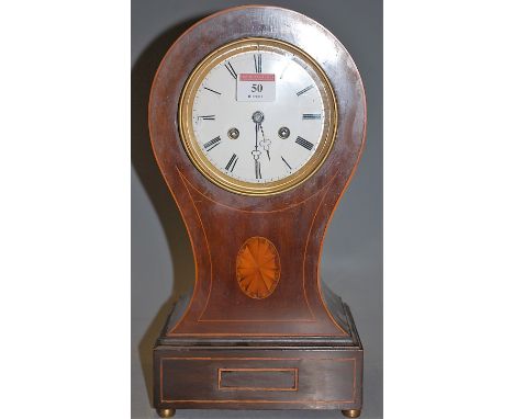 An Edwardian mahogany and satinwood strung balloon shaped mantel clock having an enamel dial with Roman numerals and eight da
