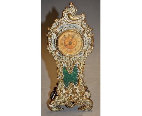 A British Union Clock Company mantel clock housed in a brass surround with a C-scroll decoration, height 26cm