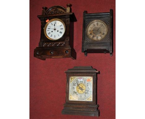A late 19th century pine cased mantel clock by The Ansonia Clock Company of New York, having a silvered chapter ring with Ara