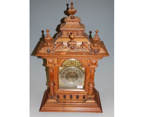 A circa 1900 German walnut cased mantel clock, with 14 day striking movement, h.61cm