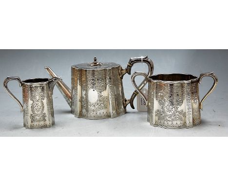 A late Victorian silver bachelor's three piece tea service of serpentine shape having floral engraved decoration, maker Walke