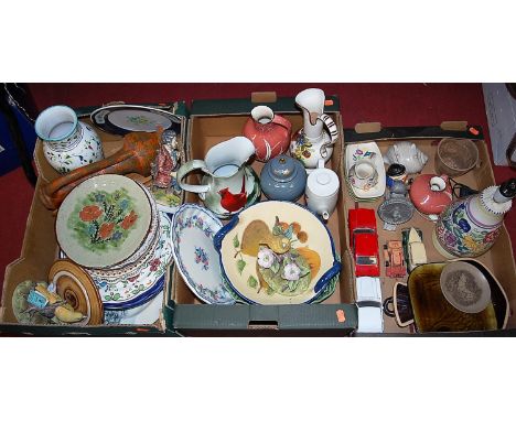 Three boxes of miscellaneous items to include Poole pottery lamp base, Akita model of a bird, etc